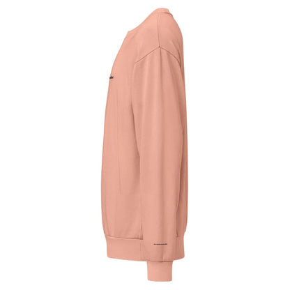 Side view of a peach-colored sweatshirt on a white background