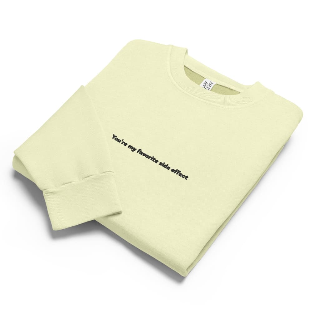 Light green sweatshirt with text on a white background