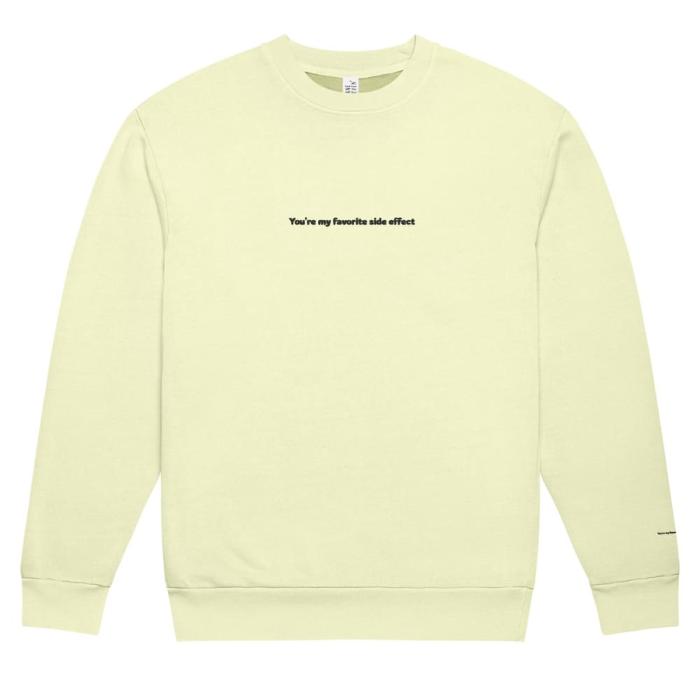 Light yellow sweatshirt with text on a white background