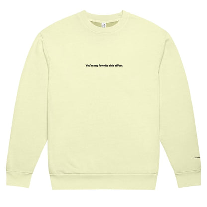 Light yellow sweatshirt with text on a white background