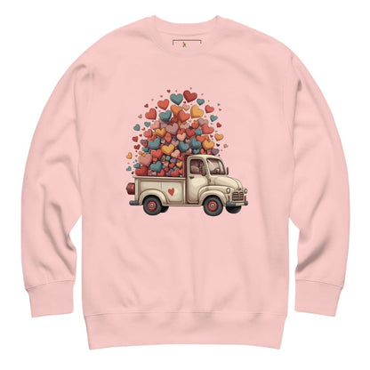 Pink sweatshirt with a truck and heart design on a white background