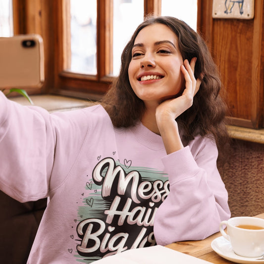 Pastel brushstroke design with “Messy Hair, Big Love” printed text on a vintage garment-dyed sweatshirt – cozy fleece for moms and creators