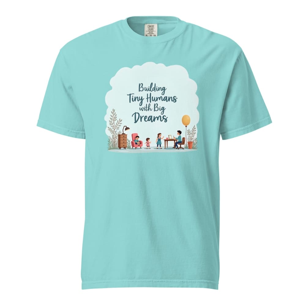 Illustrated t-shirt design with the quote "Building Tiny Humans with Big Dreams" surrounded by a family parenting scene