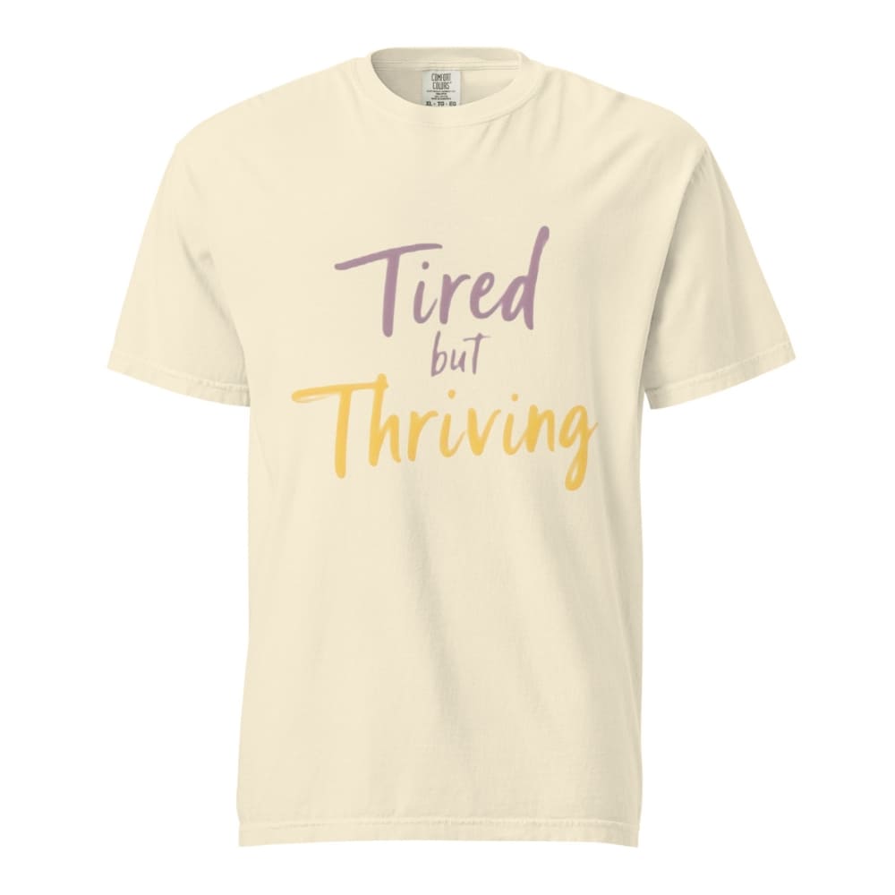 Garment-dyed relaxed fit t-shirt with motivational quote “Tired But Thriving” in modern handwritten script