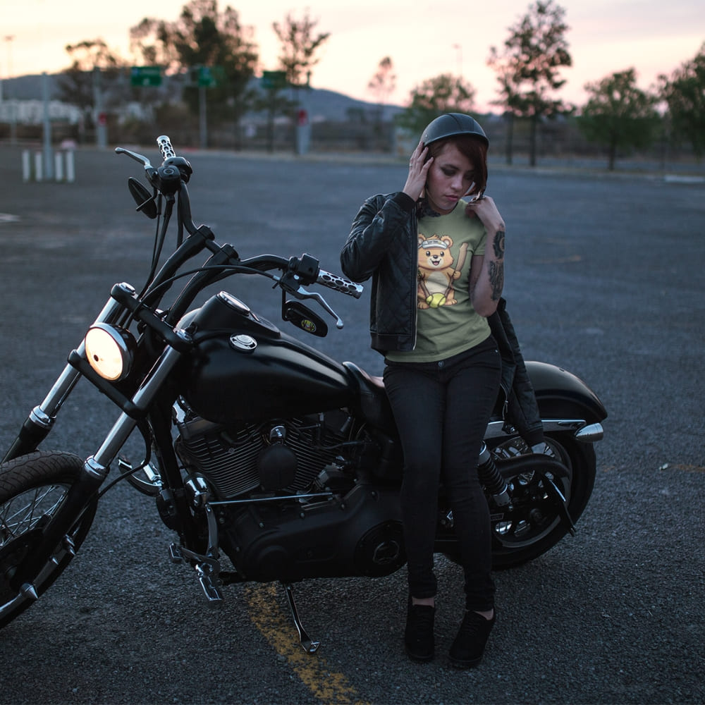 Cartoon bear holding softball bats and ball wearing a visor labeled “Softball” – printed on garment-dyed heavyweight t-shirt for sporty moms