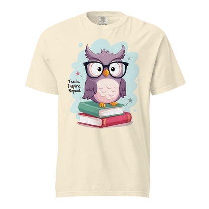Cute purple owl with glasses sitting on stacked books, with quote "Teach. Inspire. Repeat." – printed on a teacher t-shirt