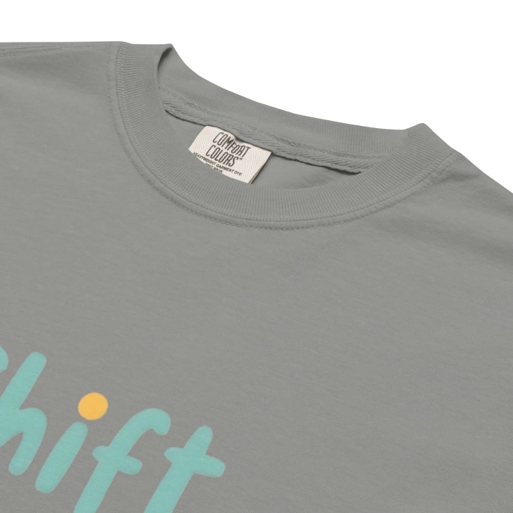 “Shift Happens – Nurse Edition” pastel text design printed on a thick garment-dyed cotton t-shirt, perfect for nurses and healthcare professionals with a sense of humor.