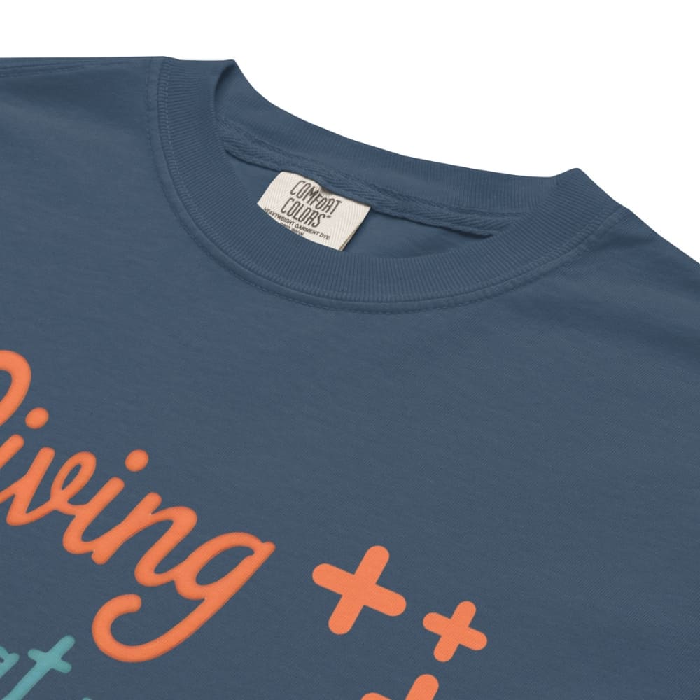 “Living That Scrub Life” colorful text printed on a garment-dyed cotton t-shirt for nurses and healthcare professionals