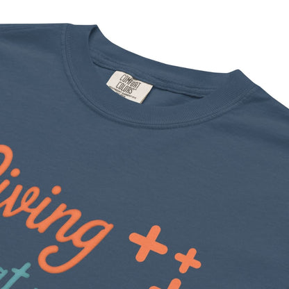 “Living That Scrub Life” colorful text printed on a garment-dyed cotton t-shirt for nurses and healthcare professionals