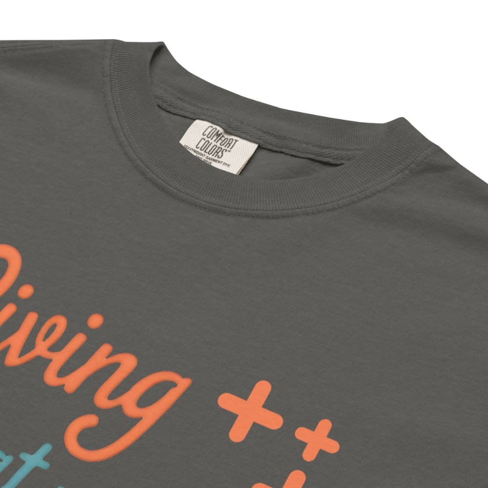 “Living That Scrub Life” colorful text printed on a garment-dyed cotton t-shirt for nurses and healthcare professionals