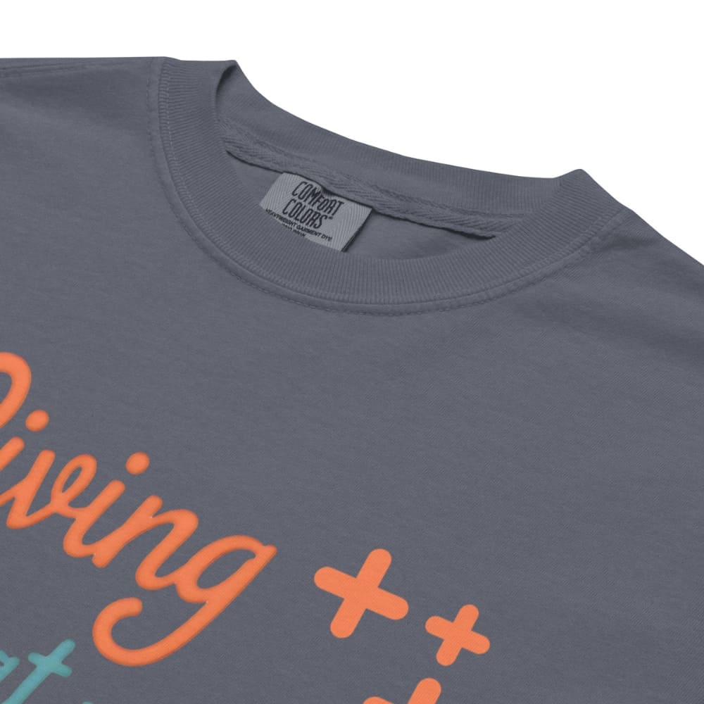 “Living That Scrub Life” colorful text printed on a garment-dyed cotton t-shirt for nurses and healthcare professionals