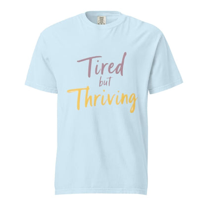 Garment-dyed relaxed fit t-shirt with motivational quote “Tired But Thriving” in modern handwritten script