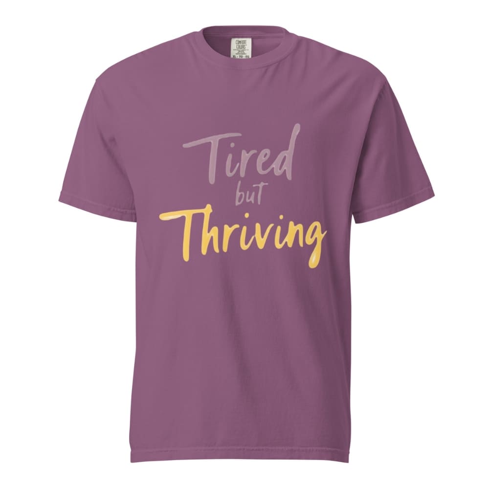 Garment-dyed relaxed fit t-shirt with motivational quote “Tired But Thriving” in modern handwritten script