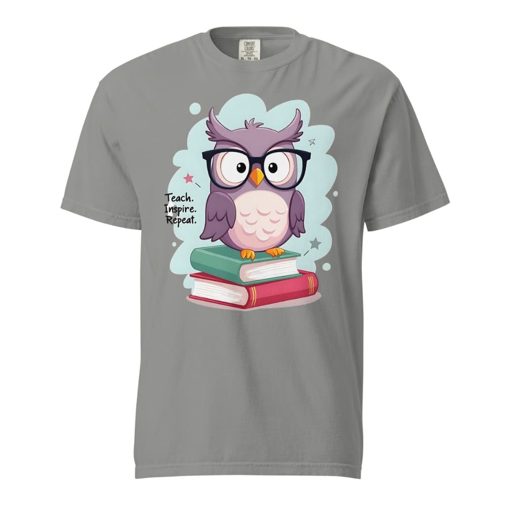 Cute purple owl with glasses sitting on stacked books, with quote "Teach. Inspire. Repeat." – printed on a teacher t-shirt