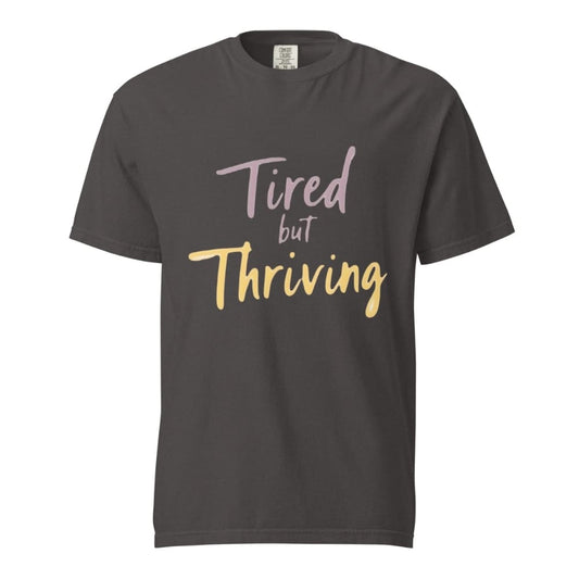 Garment-dyed relaxed fit t-shirt with motivational quote “Tired But Thriving” in modern handwritten script