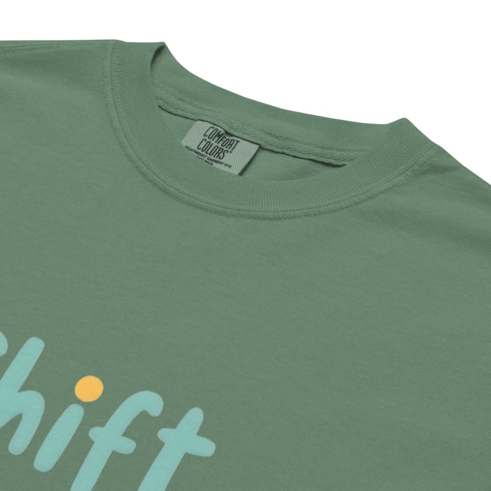 “Shift Happens – Nurse Edition” pastel text design printed on a thick garment-dyed cotton t-shirt, perfect for nurses and healthcare professionals with a sense of humor.