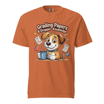 Cartoon teacher dog with coffee mug, papers, and pencil surrounded by stars with the quote "Grading Papers & Droppin’ Knowledge"