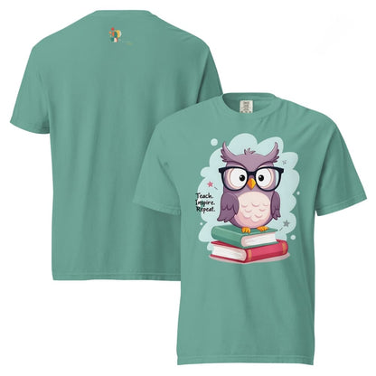 Cute purple owl with glasses sitting on stacked books, with quote "Teach. Inspire. Repeat." – printed on a teacher t-shirt