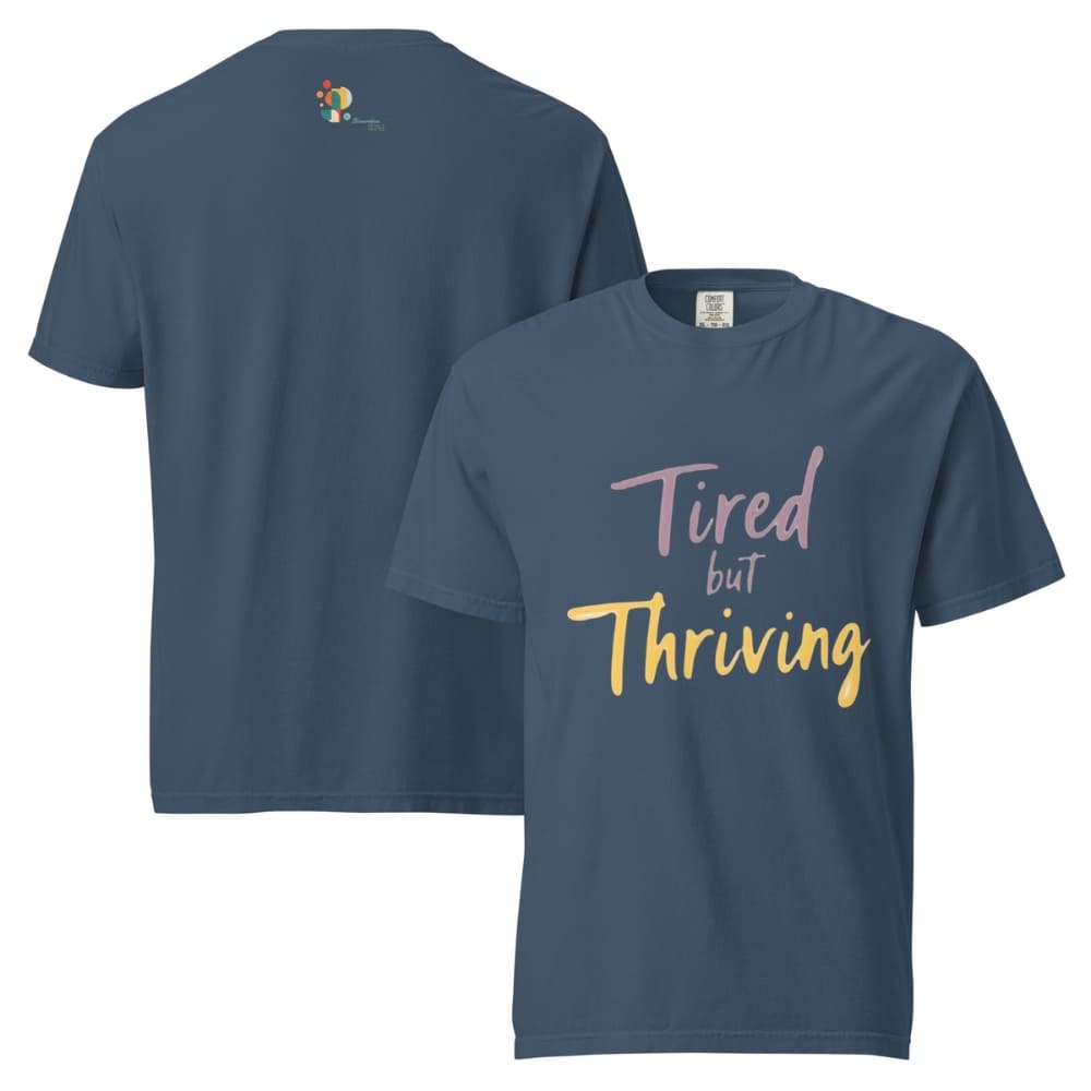 Garment-dyed relaxed fit t-shirt with motivational quote “Tired But Thriving” in modern handwritten script