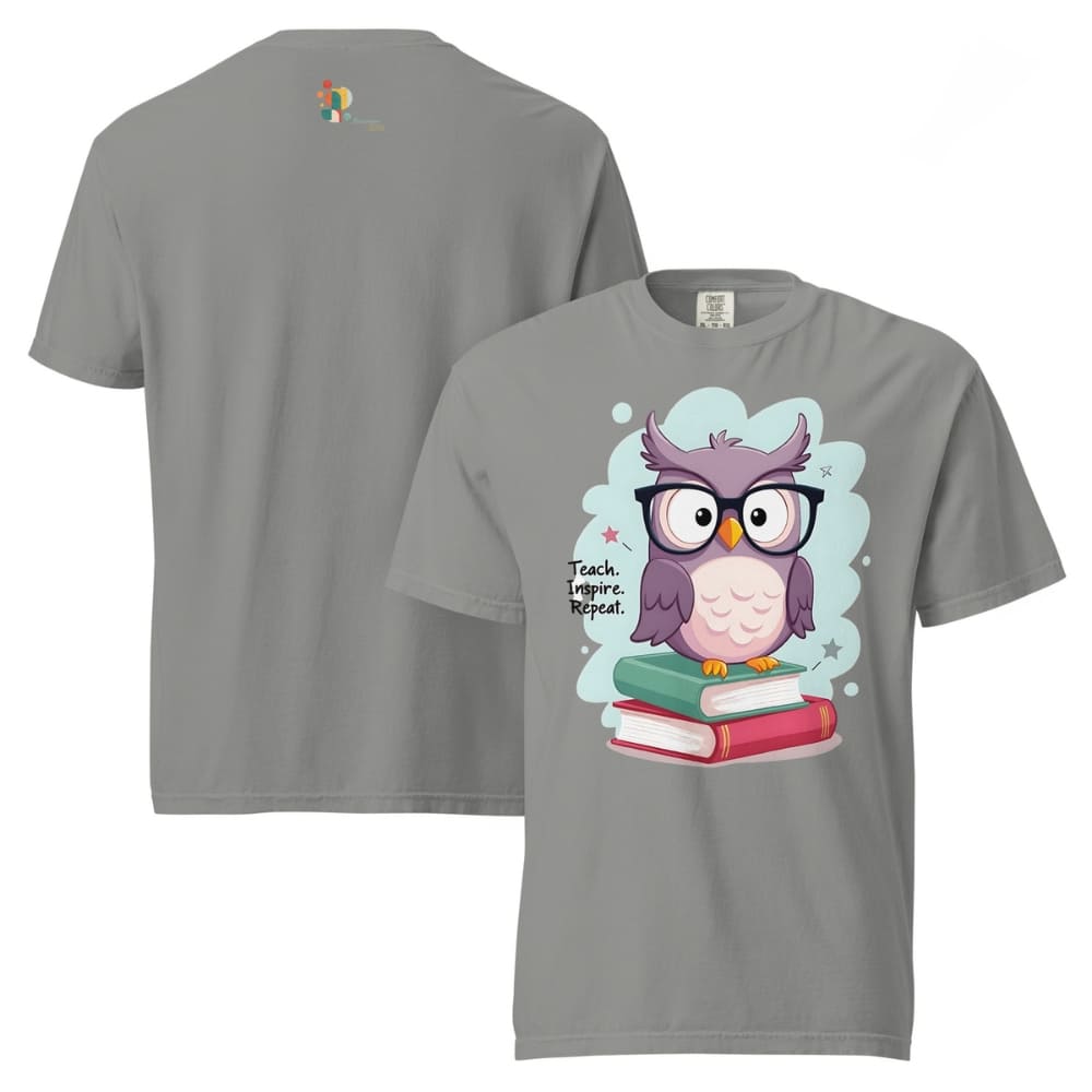 Cute purple owl with glasses sitting on stacked books, with quote "Teach. Inspire. Repeat." – printed on a teacher t-shirt