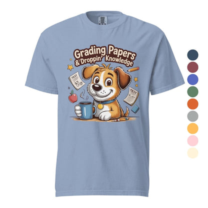 Light blue t-shirt with a cartoon dog holding a mug and text 'Grading Papers & Dropping Knowledge' on a white background.