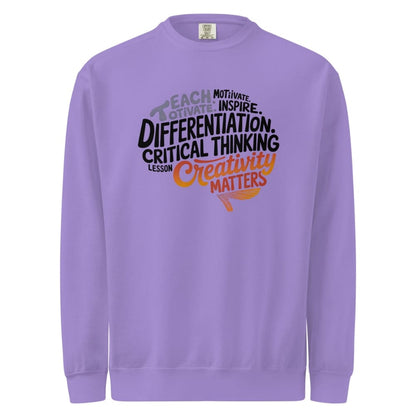 Purple sweatshirt with motivational text design on a white background