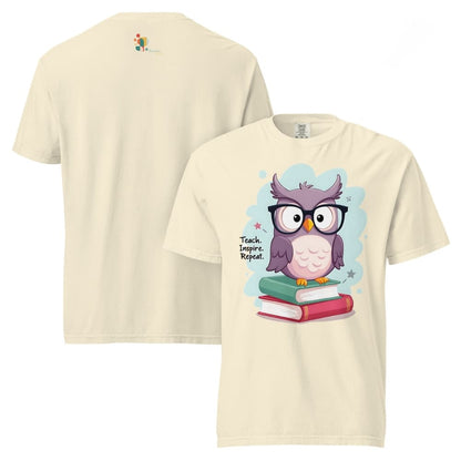 Cute purple owl with glasses sitting on stacked books, with quote "Teach. Inspire. Repeat." – printed on a teacher t-shirt