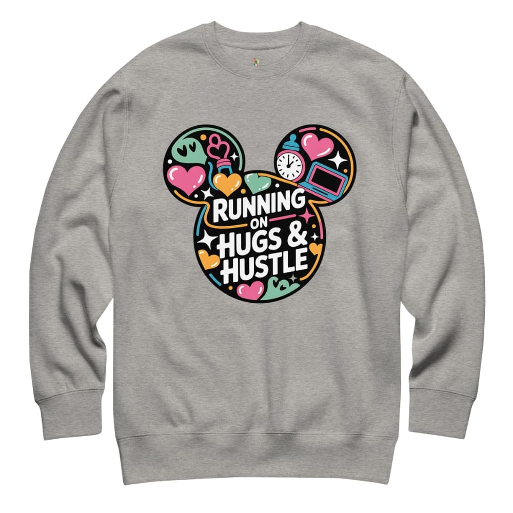 Gray sweatshirt with colorful graphic and 'Running on Hugs & Hustle' text on a white background