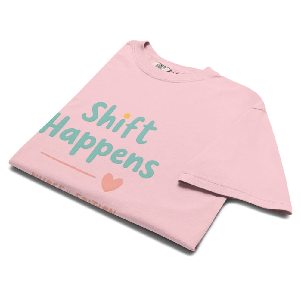 “Shift Happens – Nurse Edition” pastel text design printed on a thick garment-dyed cotton t-shirt, perfect for nurses and healthcare professionals with a sense of humor.