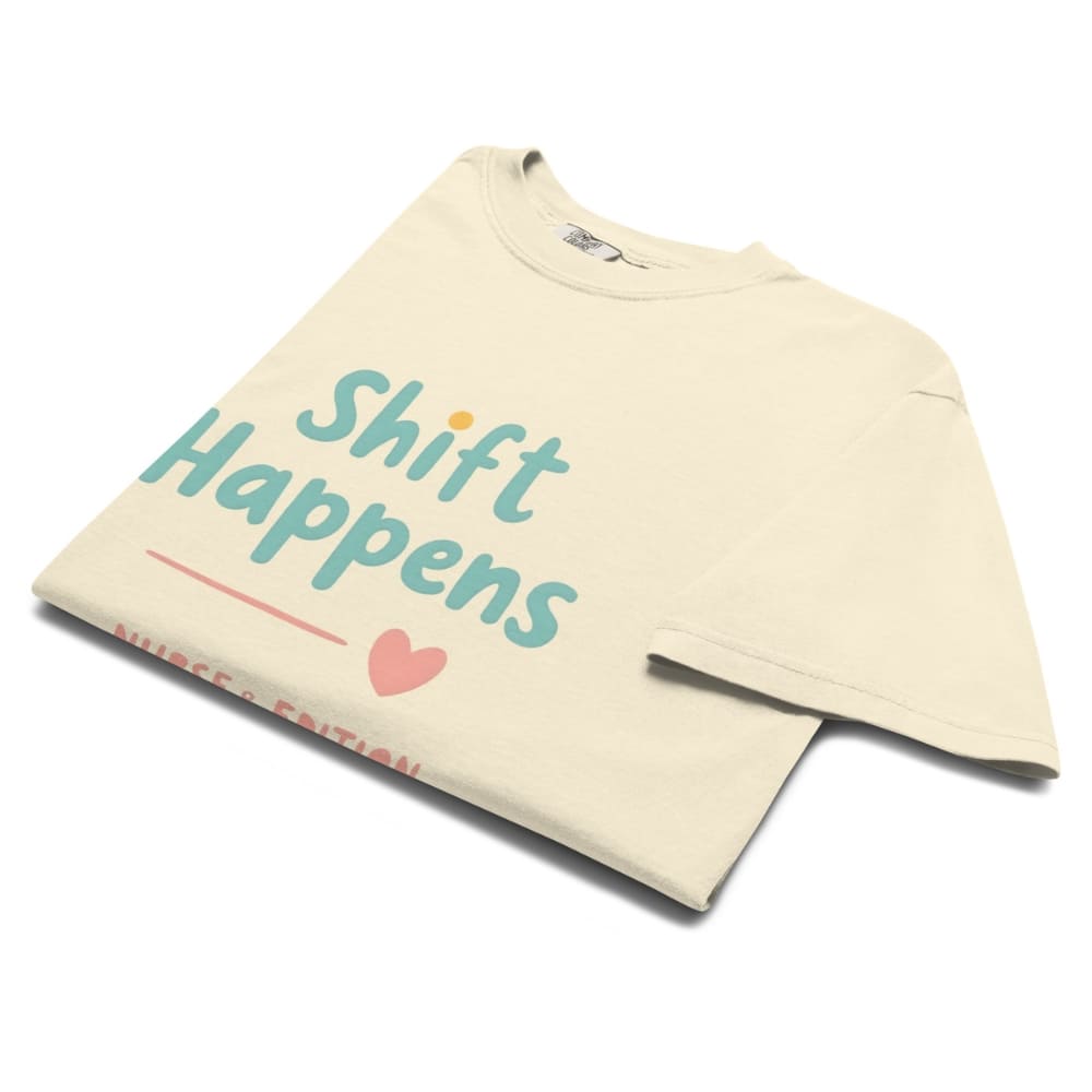 “Shift Happens – Nurse Edition” pastel text design printed on a thick garment-dyed cotton t-shirt, perfect for nurses and healthcare professionals with a sense of humor.