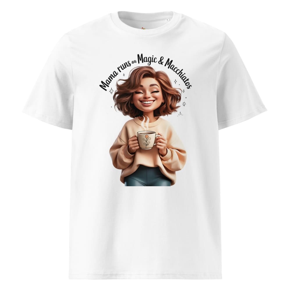 White t-shirt with a graphic of a woman holding a mug and text 'Mama runs on magic & machetes' on a white background.