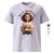 White t-shirt with a graphic of a woman holding a mug and text 'Mama runs on Magic & Machetes' on a white background.