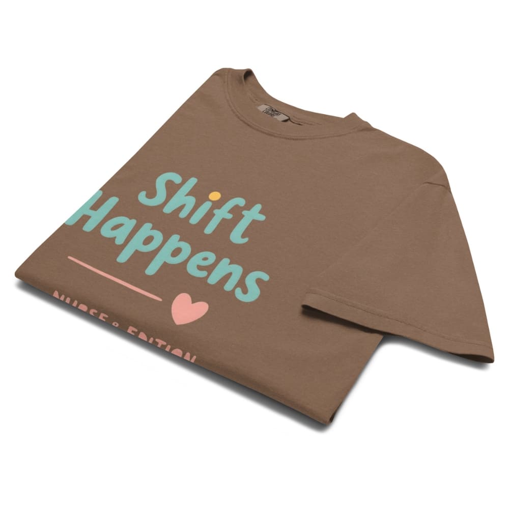 “Shift Happens – Nurse Edition” pastel text design printed on a thick garment-dyed cotton t-shirt, perfect for nurses and healthcare professionals with a sense of humor.