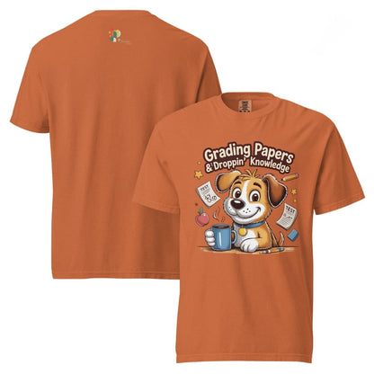 Orange t-shirt with a cartoon dog holding a mug and text 'Grading Papers & Dropping Knowledge' on a white background.