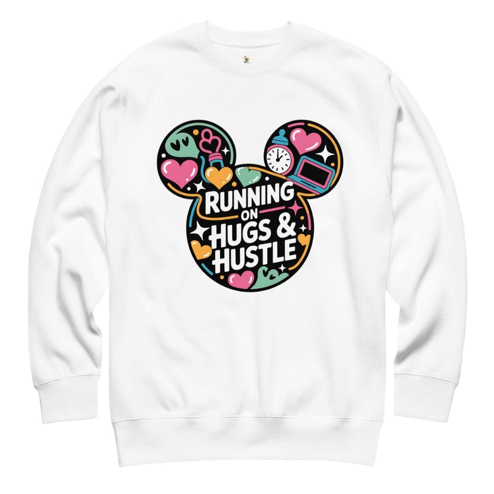 White sweatshirt with colorful graphic design and text 'Running on Hugs & Hustle' on a white background