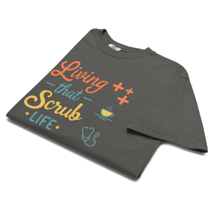 “Living That Scrub Life” colorful text printed on a garment-dyed cotton t-shirt for nurses and healthcare professionals