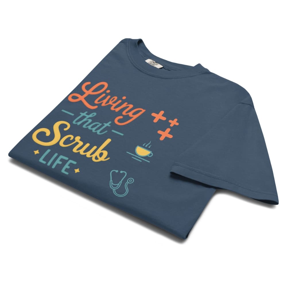 “Living That Scrub Life” colorful text printed on a garment-dyed cotton t-shirt for nurses and healthcare professionals