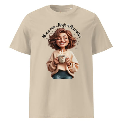 Beige t-shirt with a graphic of a woman holding a mug and text 'Mama runs on Magic & Matcha', on a white background.