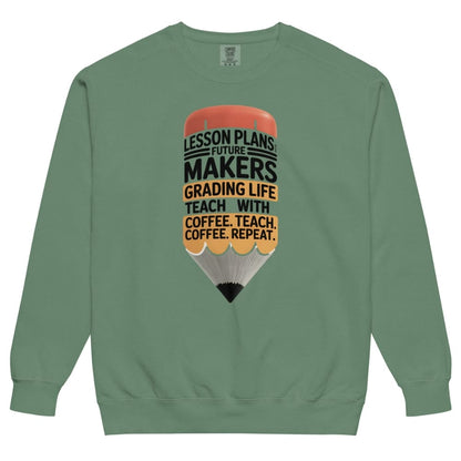 Green sweatshirt with a graphic design of a pencil and text on a white background