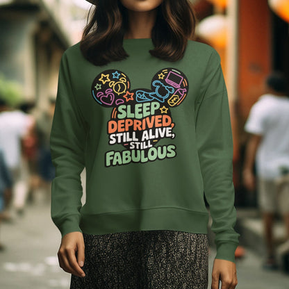 Person wearing a green sweatshirt with colorful text and graphics in an urban setting