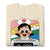 Beige t-shirt with cartoon character and 'Blood Pressure Whisperer' text on a white background