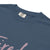 Garment-dyed relaxed fit t-shirt with motivational quote “Tired But Thriving” in modern handwritten script
