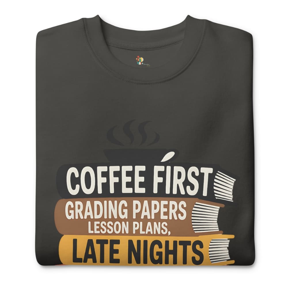 Black t-shirt with text 'Coffee First, Grading Papers, Lesson Plans, Late Nights' on a white background