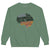Green sweatshirt with motivational text on a white background