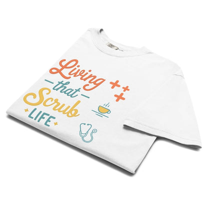 “Living That Scrub Life” colorful text printed on a garment-dyed cotton t-shirt for nurses and healthcare professionals