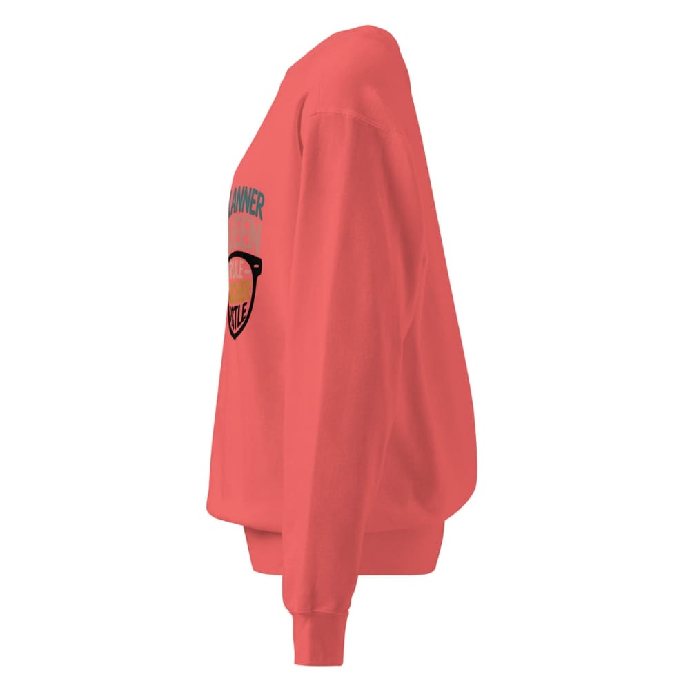 Red sweatshirt with a graphic design on the sleeve against a white background