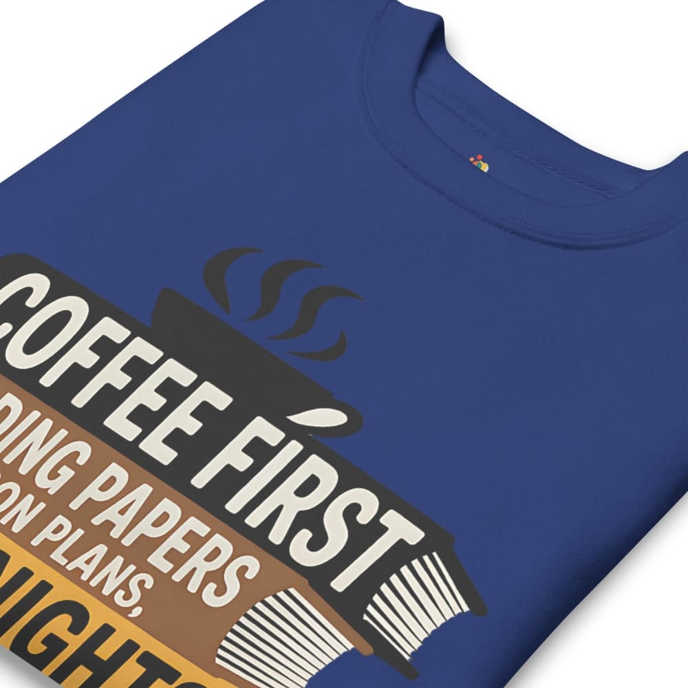 Blue t-shirt with 'Coffee First' text design on a white background