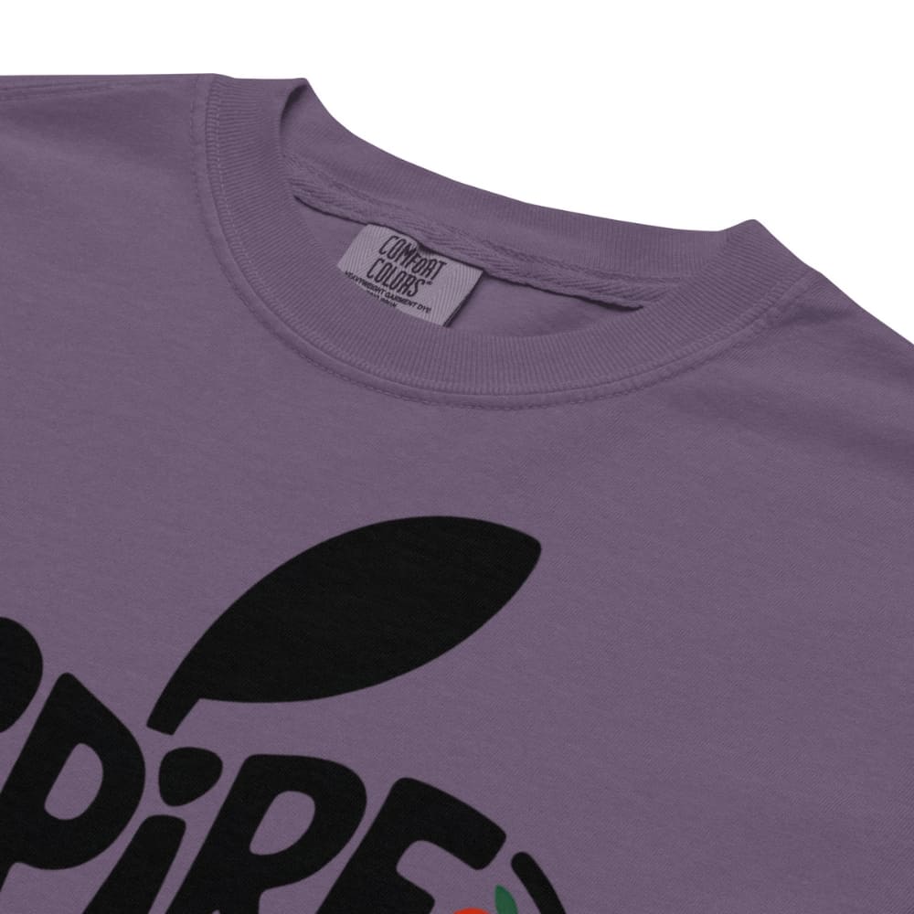 Purple t-shirt with black leaf graphic and brand tag on a white background