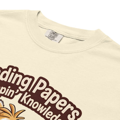 Beige t-shirt with brown text and a pineapple graphic, featuring Comfort Colors label.