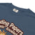 Blue t-shirt with brown text and logo on a white background